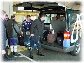 Airport Connection driver loading luggage