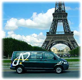 Airport Connection minivan in front of Eiffel Tower