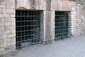 Animal cages under the bleachers of the Arenes.