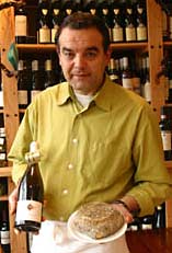 Proprietor Cherif Bourbit displays wine and cheese