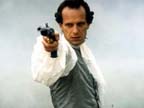 Charles Berling takes aim during a duel for honor